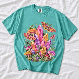 Retro 70s psychedelic glitter crystal cluster with moths and small frogs in pink, mustard, violet and mint