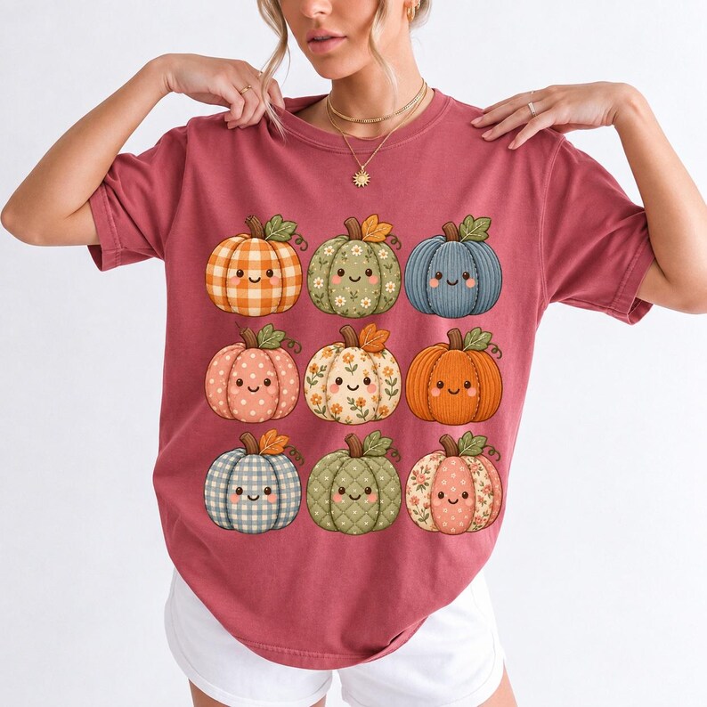 Grid of smiling pumpkins sewn from gingham, floral and corduroy patchwork fabric in autumn colors