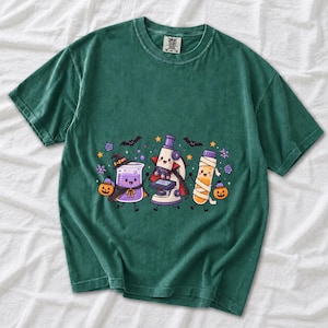 Kawaii beaker, microscope and test tube with faces in Halloween costumes, pastel purple and orange