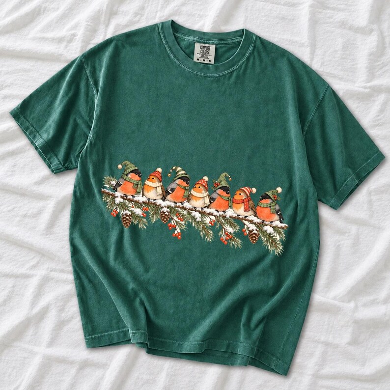 Watercolor bullfinches and robins in elf hats and scarves on a snowy pine branch