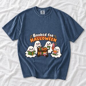 Four kawaii ghosts with books, a library cart and bookmarks, text Booked for Halloween