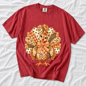 Turkey with patchwork fabric tail feathers decorated with bows on a cream and polka-dot stripe background