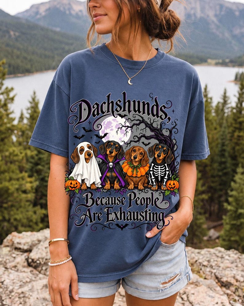 Four dachshunds in Halloween costumes under a spooky tree with text Dachshunds, Because People Are Exhausting