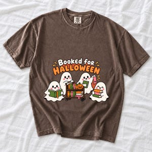 Four kawaii ghosts with books, a library cart and bookmarks, text Booked for Halloween