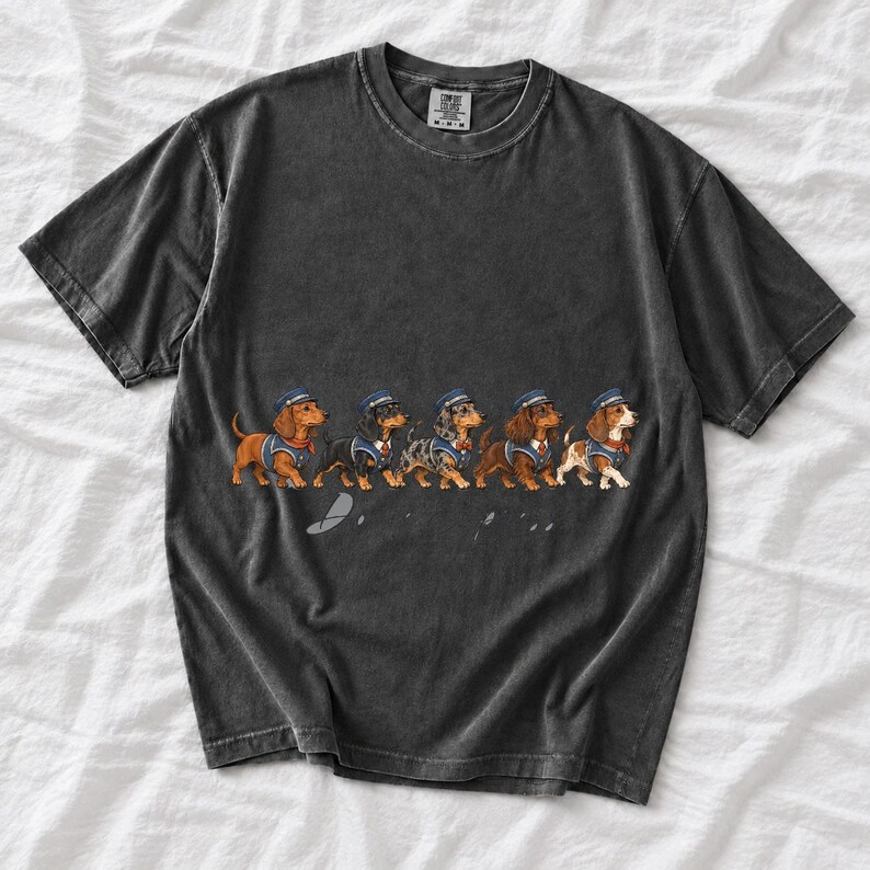 Illustrated dachshunds in conductor hats lined up like a train, text Doxie Express