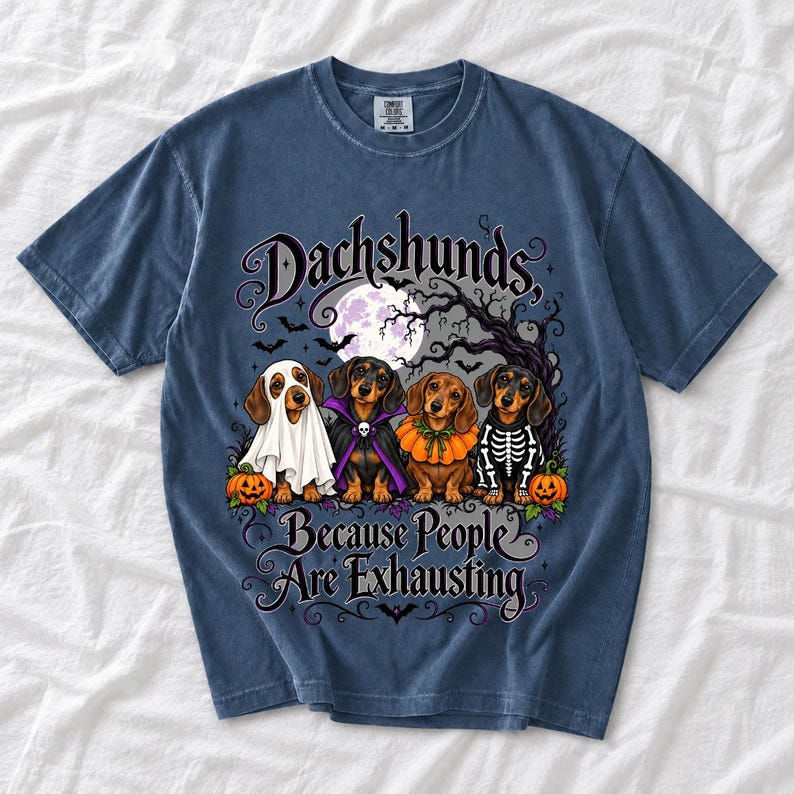 Four dachshunds in Halloween costumes under a spooky tree with text Dachshunds, Because People Are Exhausting
