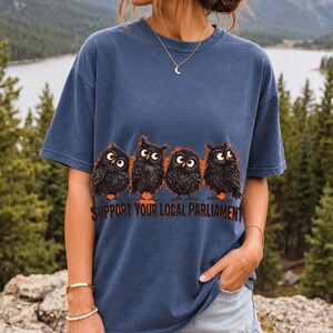 Four fluffy big-eyed black owls in a row with the text "Support Your Local Parliament"