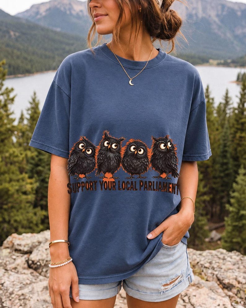 Four fluffy big-eyed black owls in a row with the text "Support Your Local Parliament"