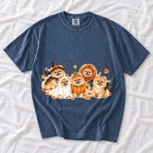 Five fluffy watercolor pomeranians in Halloween costumes with autumn leaves and bats