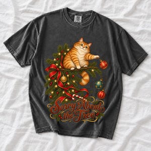Рыжий кот роняет ёлочные игрушки «Sorry About the Tree»