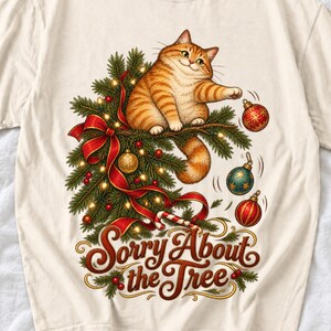 Рыжий кот роняет ёлочные игрушки «Sorry About the Tree»