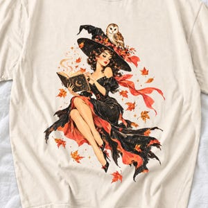 Retro 1950s pin-up witch floating while reading a spell book with an owl on her hat, autumn leaves