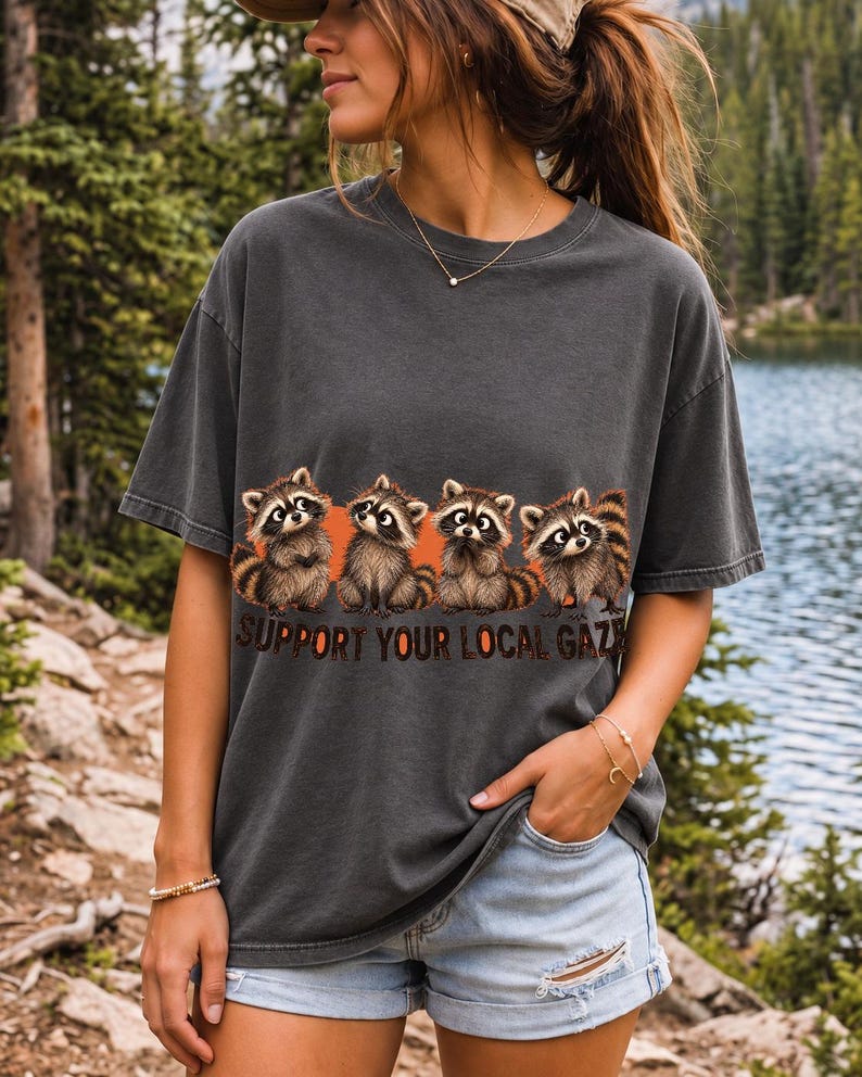 Four raccoons in a row with the text "Support Your Local Gaze"