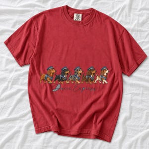 Illustrated dachshunds in conductor hats lined up like a train, text Doxie Express