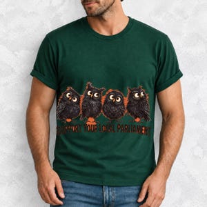 Four fluffy big-eyed black owls in a row with the text "Support Your Local Parliament"