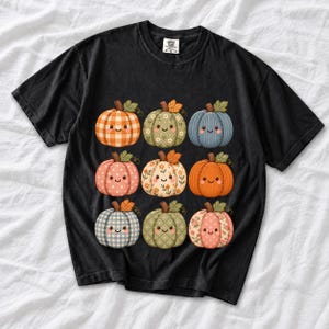 Grid of smiling pumpkins sewn from gingham, floral and corduroy patchwork fabric in autumn colors