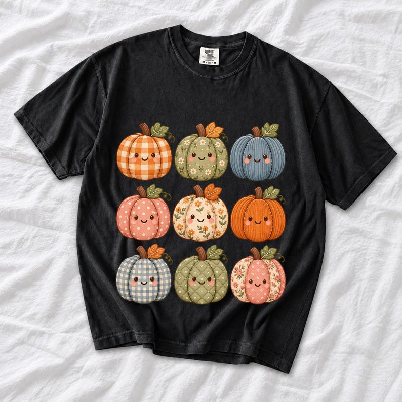 Grid of smiling pumpkins sewn from gingham, floral and corduroy patchwork fabric in autumn colors