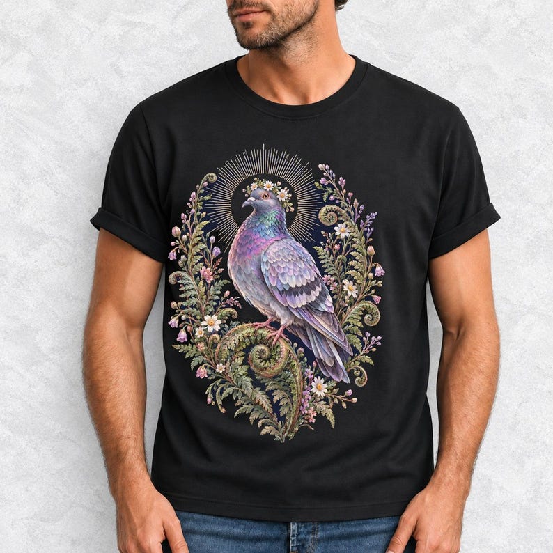 Painted pigeon wearing a daisy crown and glowing halo standing on a fern frond, whimsical cottagecore bird t-shirt art