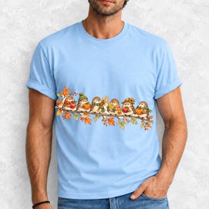 Row of watercolor sparrows on a branch holding tiny apples, corn and a pumpkin for harvest