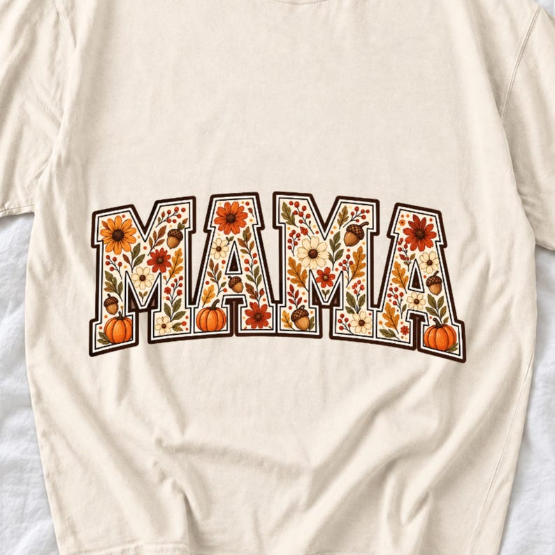 Arched varsity word MAMA filled with fall flowers and acorns in cream, rust and mustard