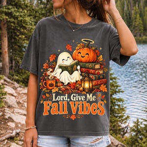 Smiling pumpkin with a halo beside a stack of books and a lantern, text "Lord, Give Me Fall Vibes", retro fall illustration