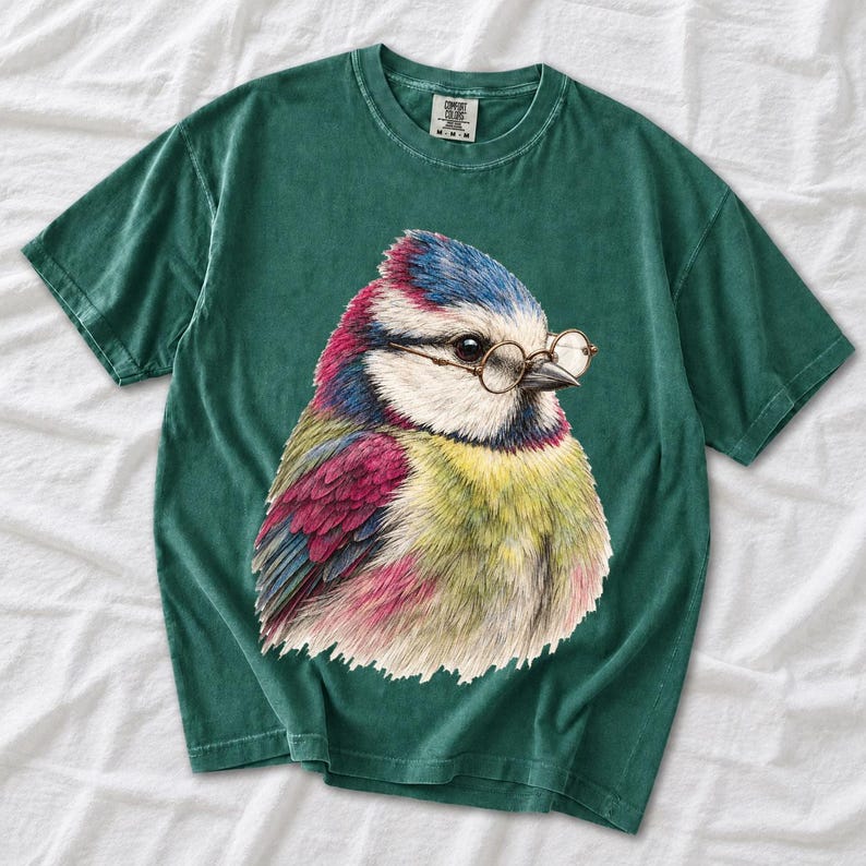 Colored-pencil blue tit bird wearing tiny round reading glasses, funny birdwatcher t-shirt illustration