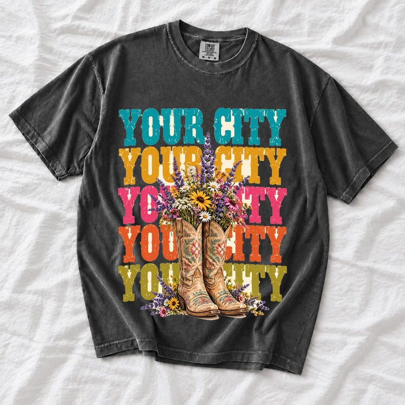 Tan cowboy boots with lavender and wildflowers over a five-line stacked personalized city word in retro colors