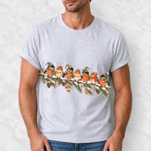 Watercolor bullfinches and robins in elf hats and scarves on a snowy pine branch