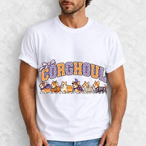 Six corgis in Halloween costumes walking under the arched word CORGHOUL, lavender and orange polka-dot varsity style