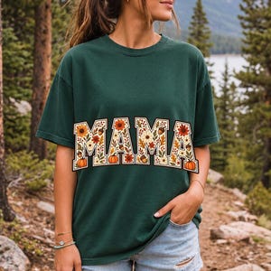 Arched varsity word MAMA filled with fall flowers and acorns in cream, rust and mustard