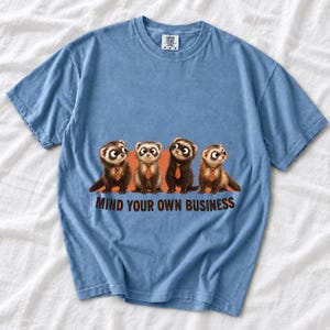 Four ferrets in tiny ties in a row with the text "Mind Your Own Business"