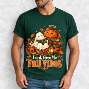 Smiling pumpkin with a halo beside a stack of books and a lantern, text "Lord, Give Me Fall Vibes", retro fall illustration