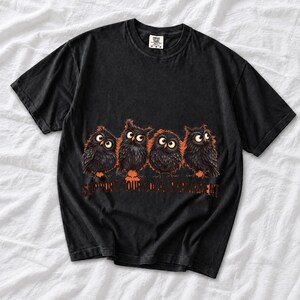 Four fluffy big-eyed black owls in a row with the text "Support Your Local Parliament"
