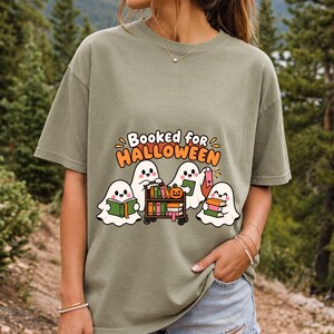Four kawaii ghosts with books, a library cart and bookmarks, text Booked for Halloween
