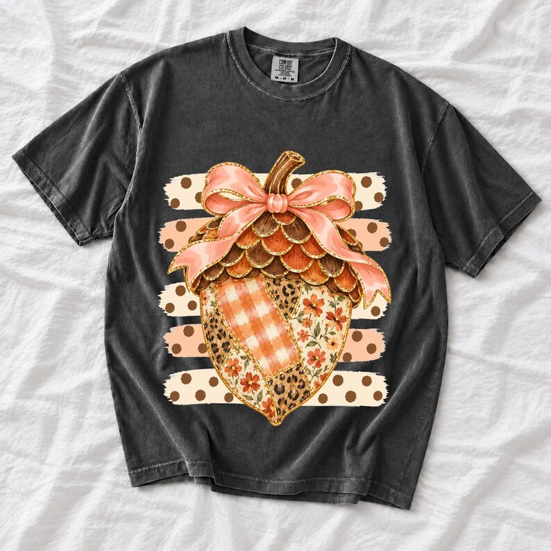 Giant patchwork acorn with a pink satin bow made of plaid, leopard and floral fabric on polka-dot stripes