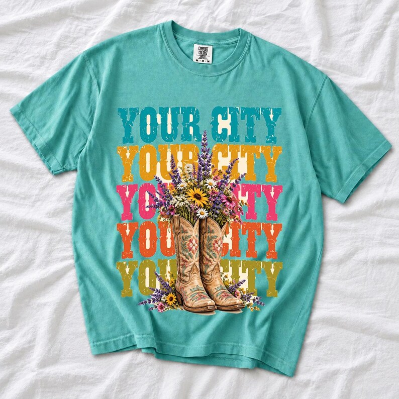 Tan cowboy boots with lavender and wildflowers over a five-line stacked personalized city word in retro colors