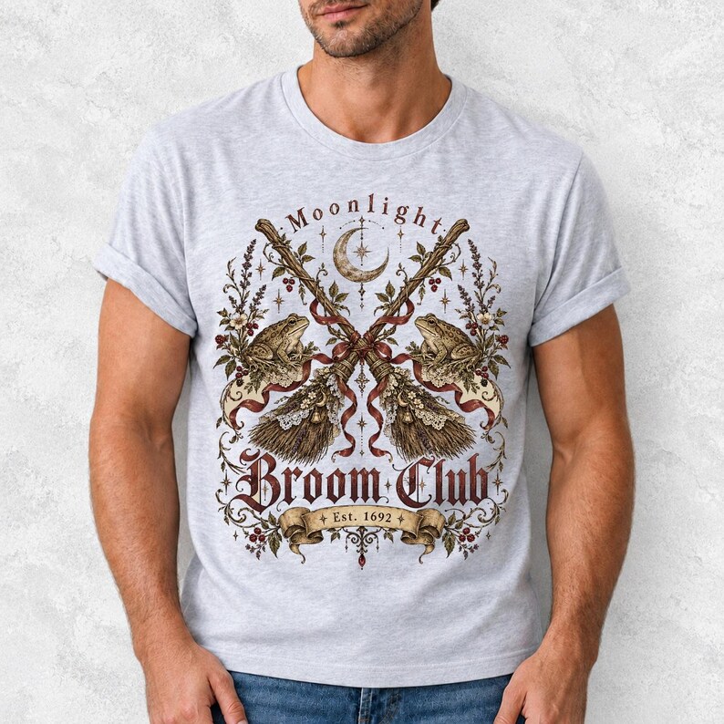 Vintage poster style crossed broomsticks with ribbons, lace and toads, text Moonlight Broom Club Est. 1692