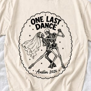 Two skeletons dancing tango, one in a veil, in a starry frame with the text One Last Dance Austin 2026