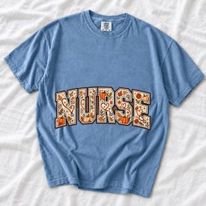 Arched varsity word NURSE filled with autumn leaves, stethoscopes and pumpkins in cream, rust and mustard
