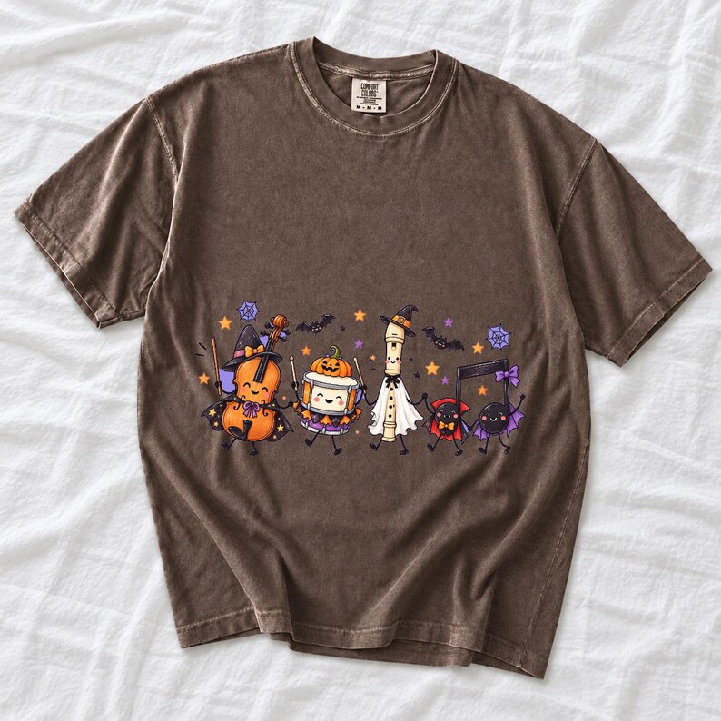 Kawaii violin, drum, recorder and notes with faces in Halloween costumes, pastel purple and orange