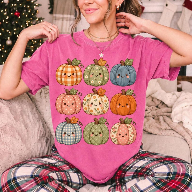 Grid of smiling pumpkins sewn from gingham, floral and corduroy patchwork fabric in autumn colors