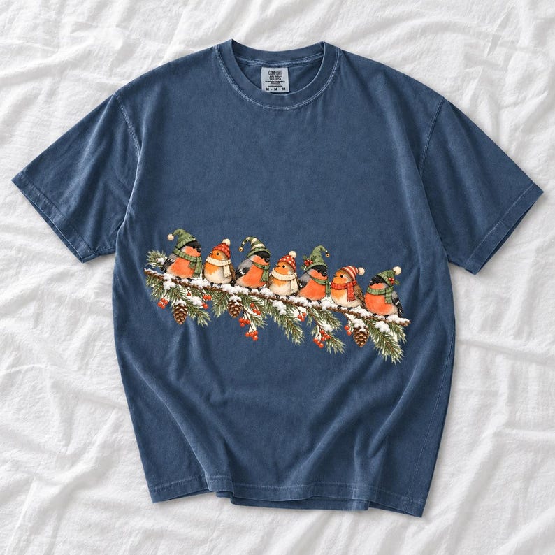 Watercolor bullfinches and robins in elf hats and scarves on a snowy pine branch