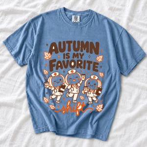 Cute pumpkin characters in nurse caps with clipboards and coffee, text Autumn Is My Favorite Shift