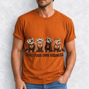 Four ferrets in tiny ties in a row with the text "Mind Your Own Business"