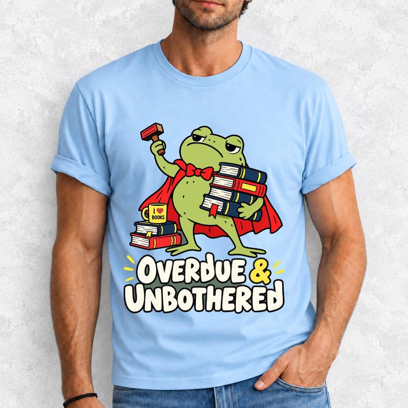 Grumpy cartoon frog librarian holding a stamp and a stack of books with the text Overdue & Unbothered
