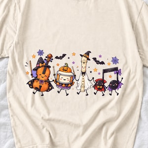 Kawaii violin, drum, recorder and notes with faces in Halloween costumes, pastel purple and orange