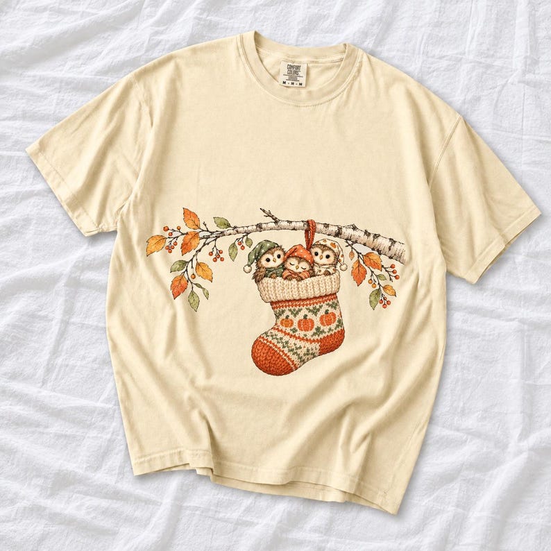 Three watercolor owlets in pajamas and nightcaps tucked into a knitted stocking on a birch branch, one asleep