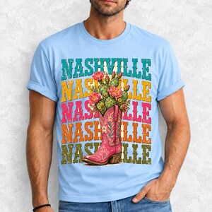 Pink embroidered cowboy boot with blooming cactus over a five-line stacked NASHVILLE word in retro colors