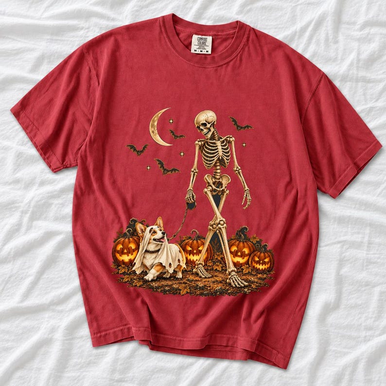 A skeleton walking a corgi in a ghost costume past carved pumpkins under a crescent moon