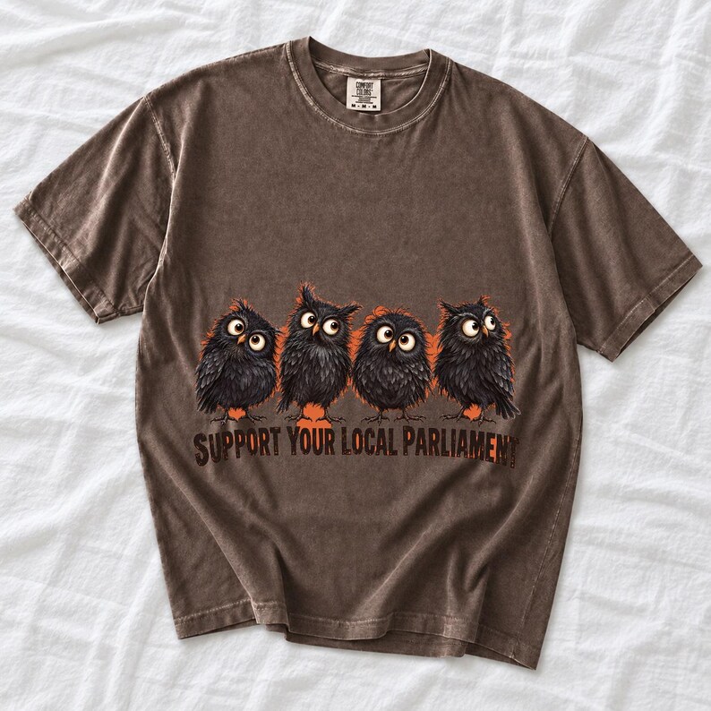 Four fluffy big-eyed black owls in a row with the text "Support Your Local Parliament"